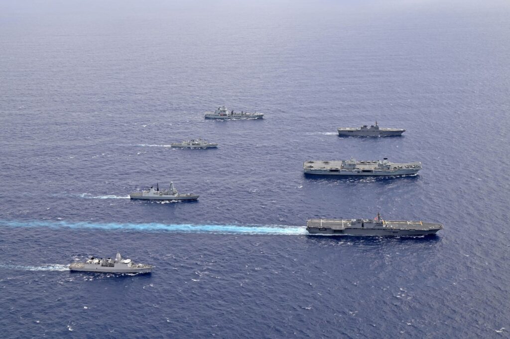 HMS Queen Elizabeth (middle right) and Izumo (front right) during joint training (September 2021)
